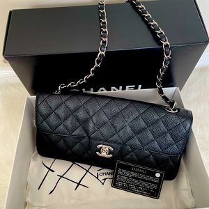 Chanel east west flap black caviar medium classic.